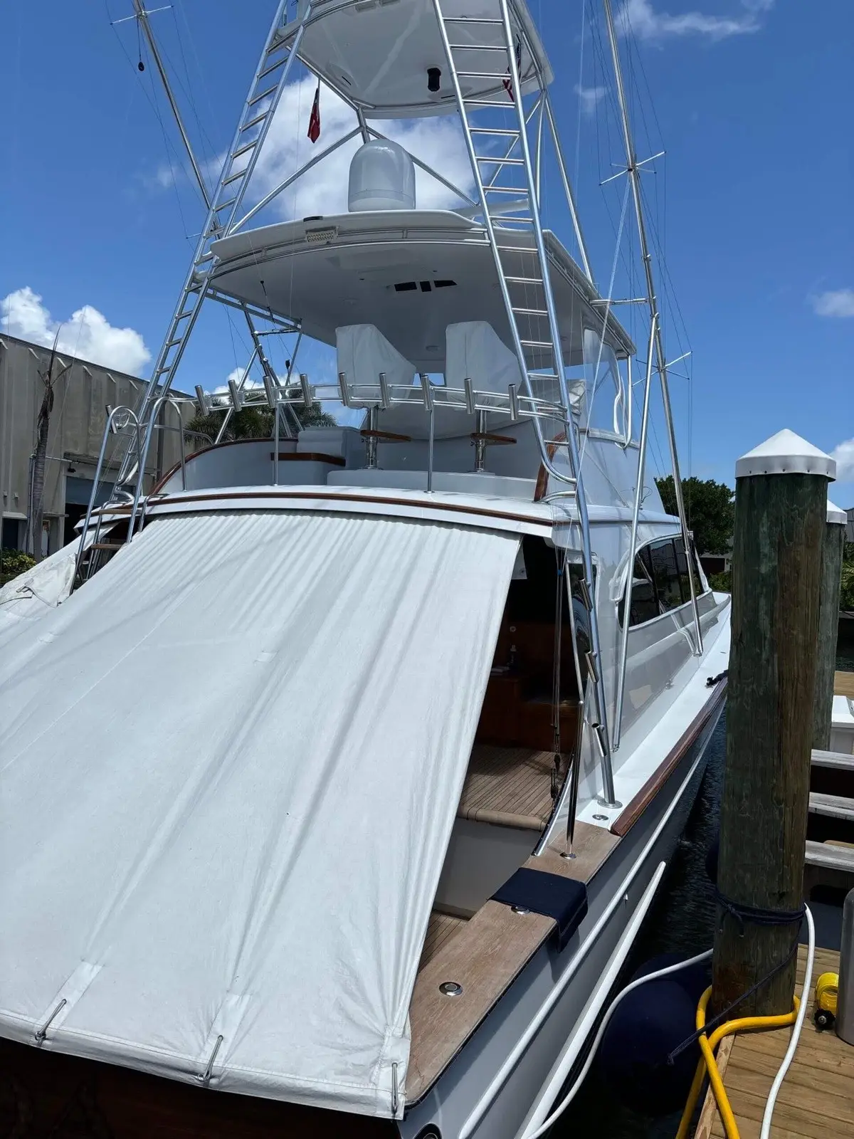 Yacht hull and topside after detailing, South Florida waterway in background
